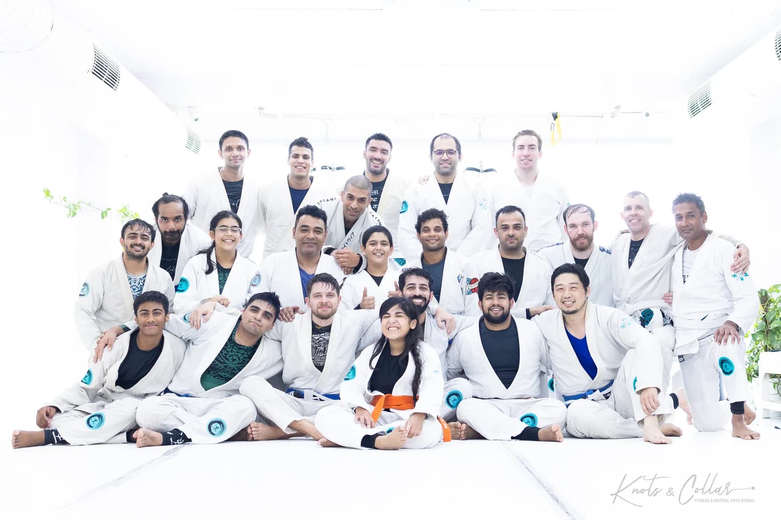 The Knots & Collar Brazilian Jiu-Jitsu community — adults, teenagers and children together after class at the Defence Colony martial arts studio in New Delhi
