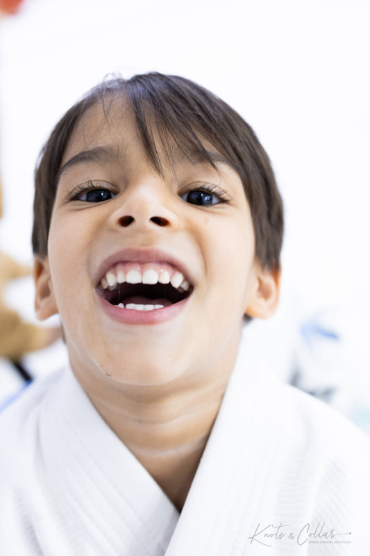 Happy young boy in BJJ gi at Knots and Collar kids class Defence Colony New Delhi