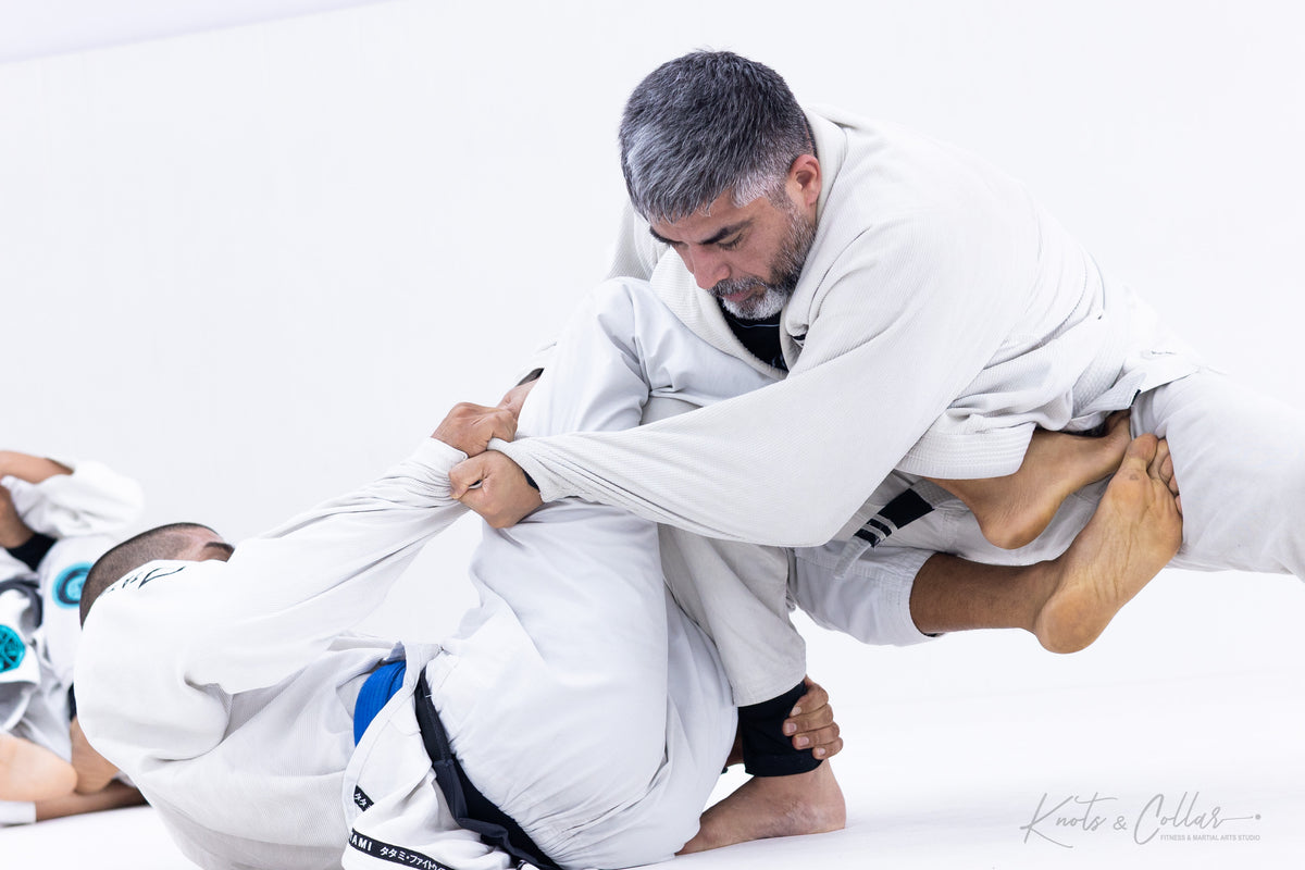 Adult BJJ gi guard passing at Knots and Collar Defence Colony New Delhi