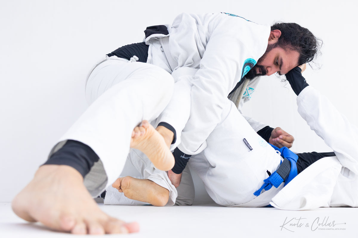 Adult BJJ gi guard sweep at Knots and Collar Defence Colony Delhi