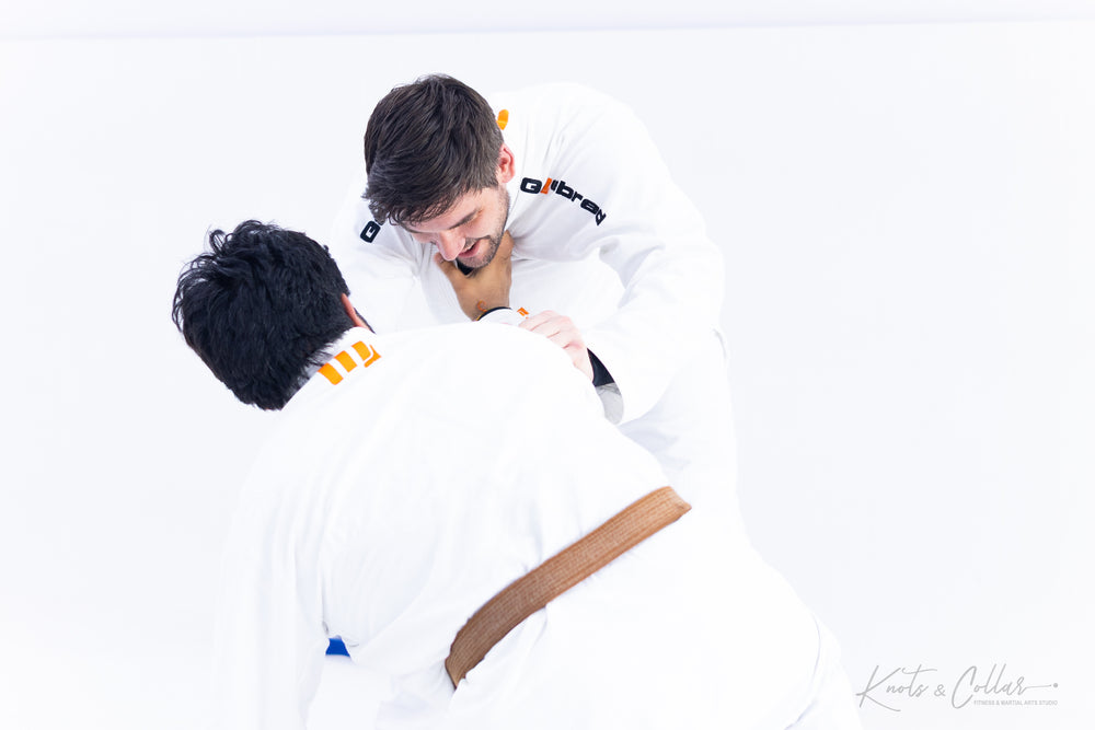 Brown belt BJJ practitioner sparring and drilling technique