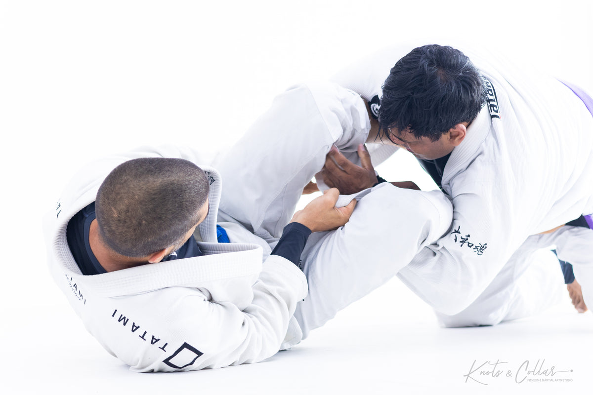 BJJ ground control position during gi sparring at Knots and Collar New Delhi