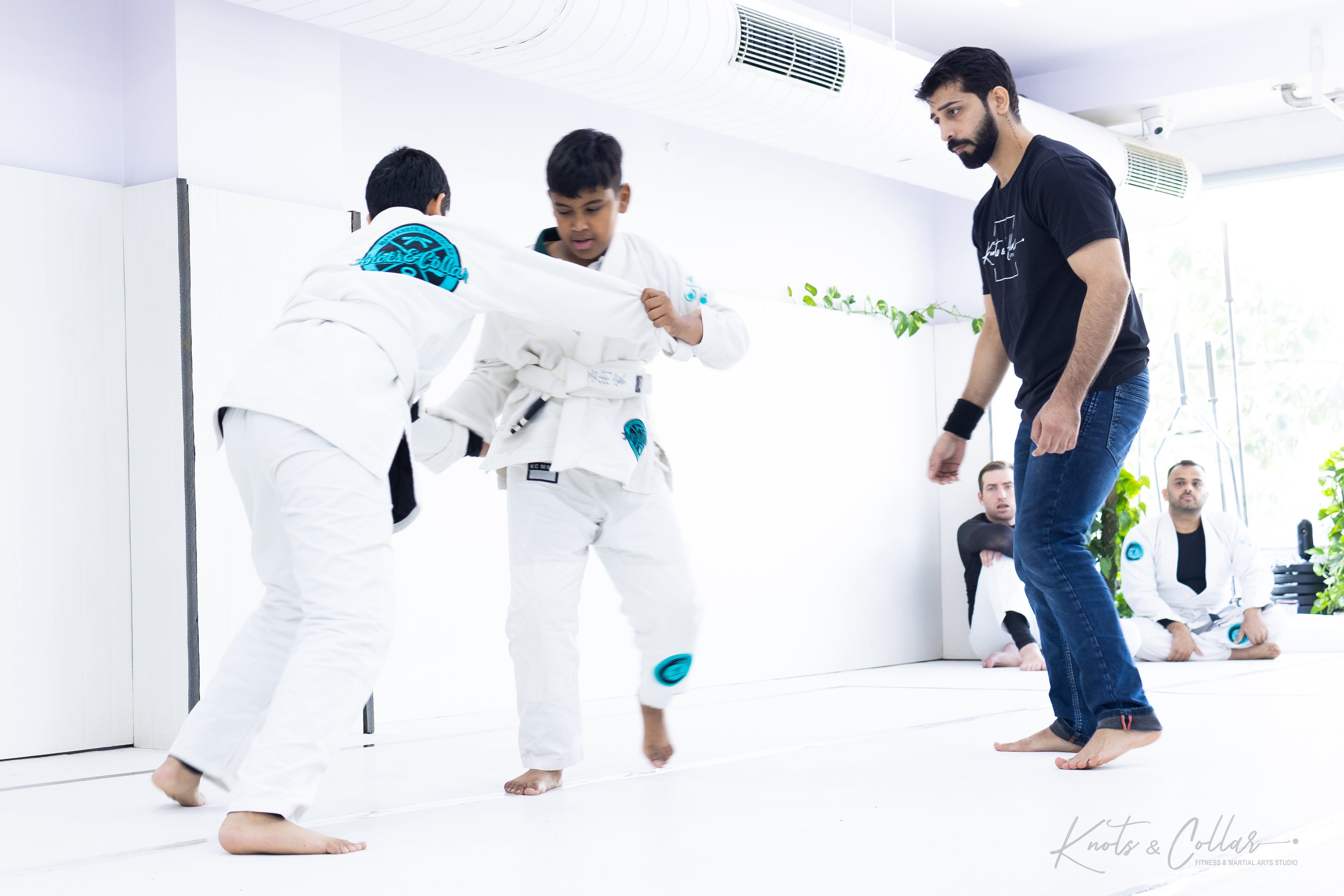 Child practising jiu jitsu techniques at Knots and Collar Delhi