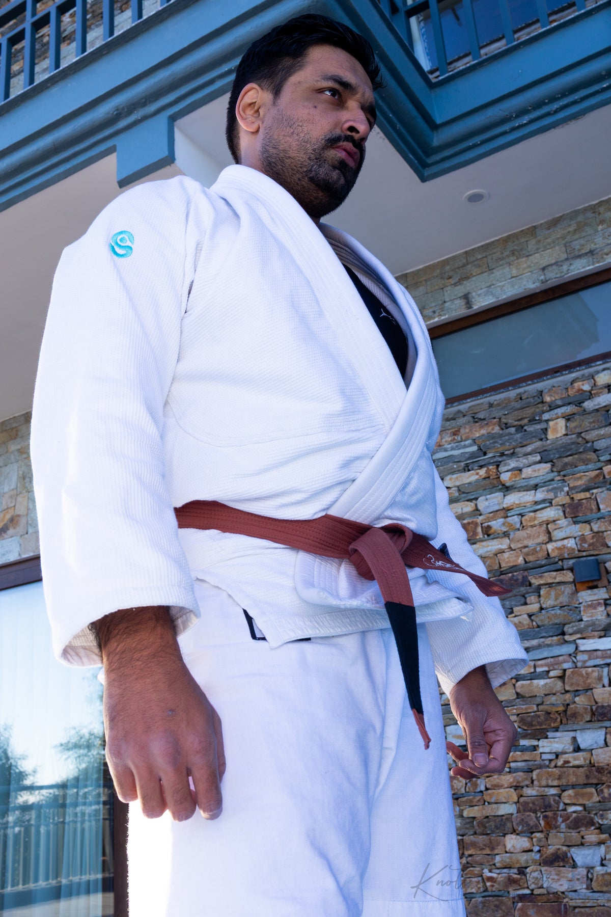 BJJ practitioner in gi at Knots and Collar jiu-jitsu India — De La Riva lineage