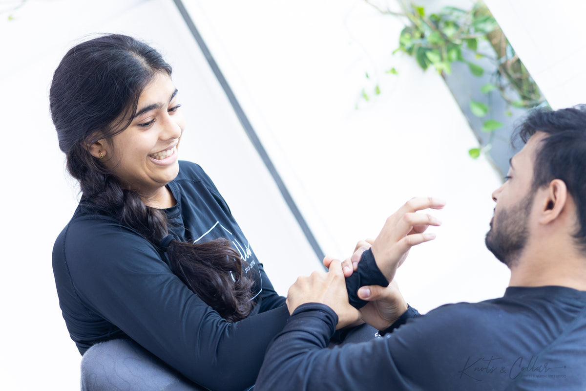 Woman learning BJJ technique at Knots and Collar Defence Colony New Delhi