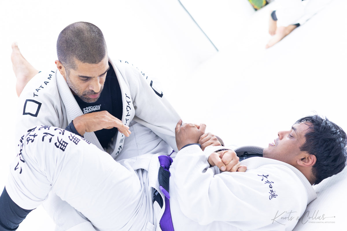 BJJ blue belt student at Knots and Collar working guard pass at Knots and Collar Delhi