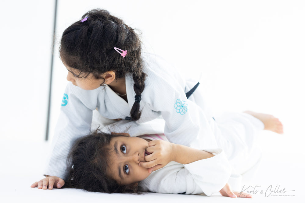 Girls practicing BJJ grappling at kids jiu-jitsu class Knots and Collar Defence Colony New Delhi