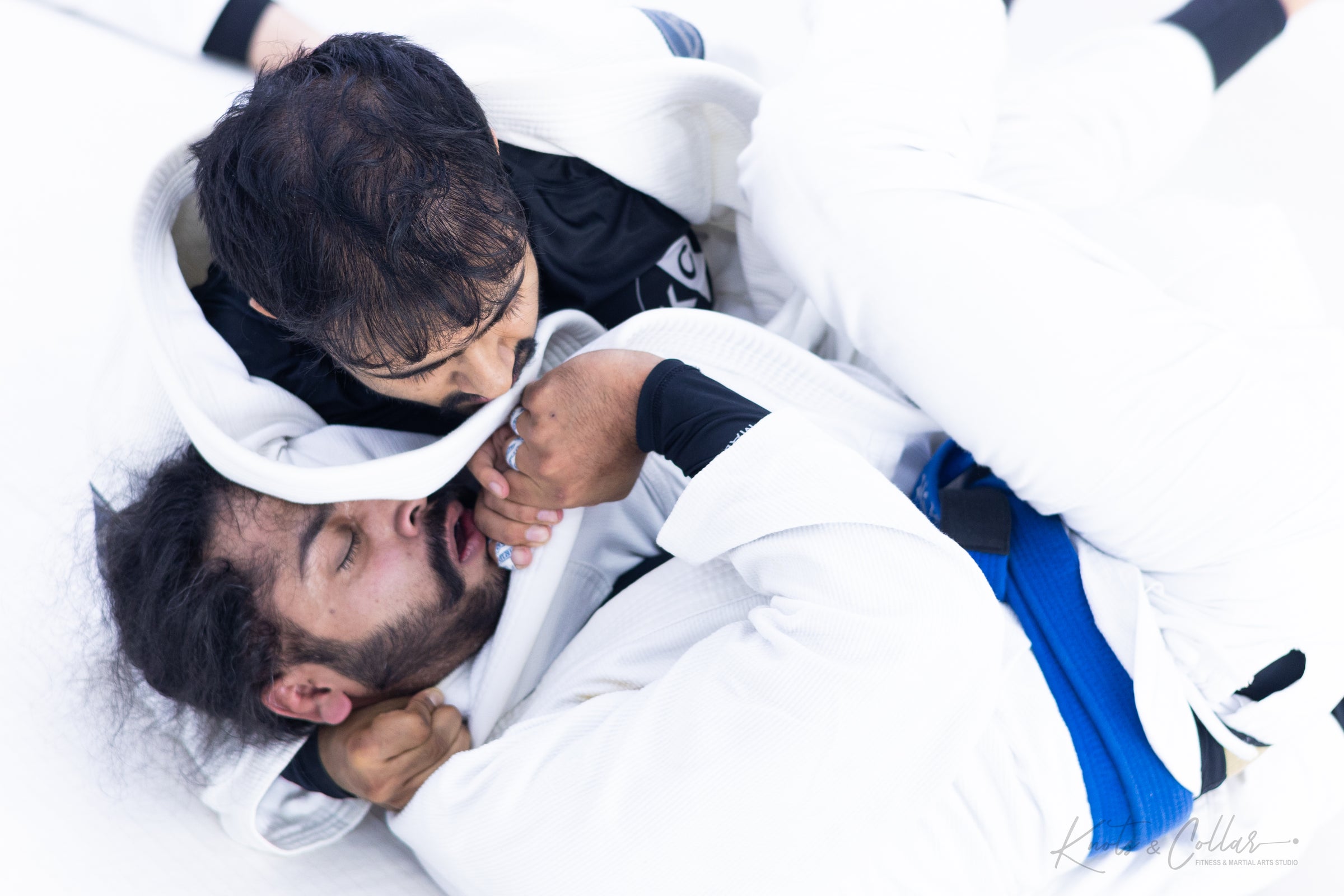 BJJ students rolling gi sparring submission drill at Knots and Collar Defence Colony New Delhi
